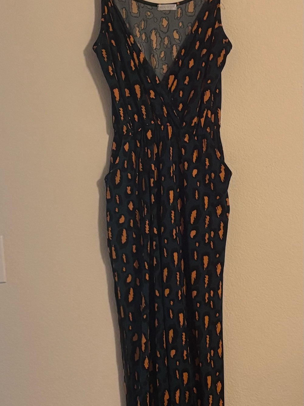 Sleeveless Black Jumpsuit with Orange Spot Print - V-Neck Romper